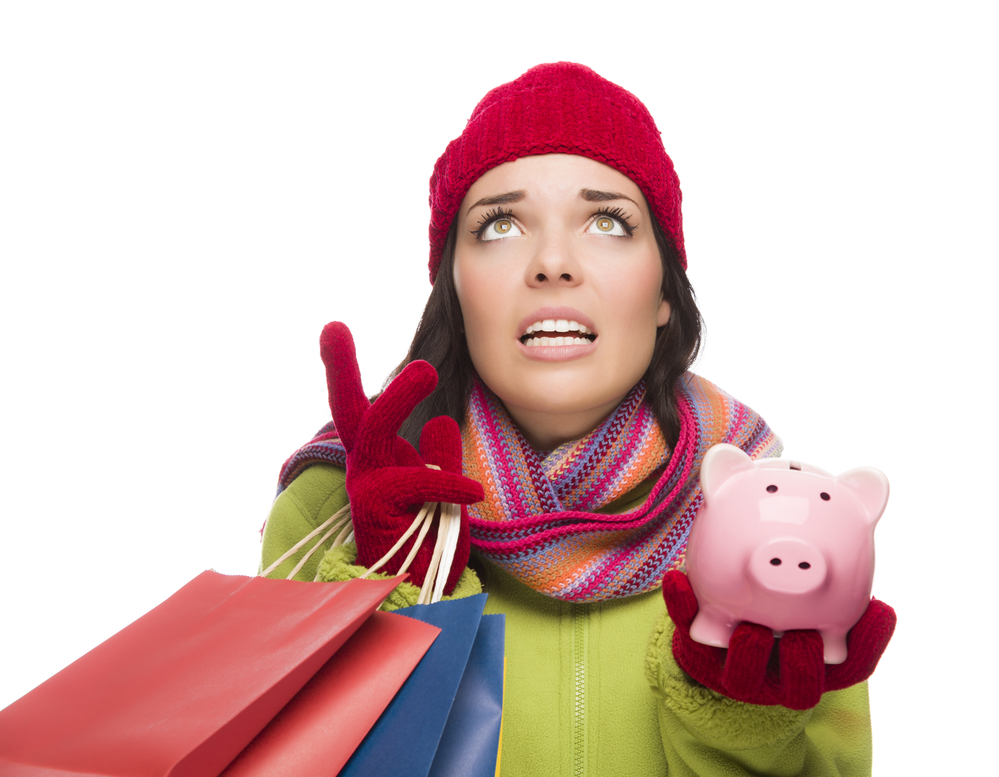 Женщина с подарками и копилкой - не хватает денег на Новый год